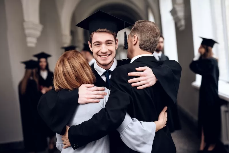 Parents,Congratulate,The,Student,,Who,Finish,Their,Studies,At,The Image showing students are walking in university hall